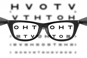 Glasses in Front of an Eye Chart